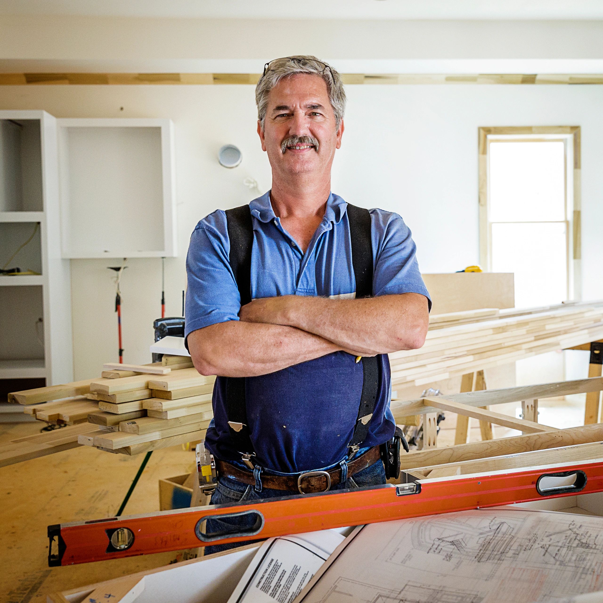 Tradesman with blueprints